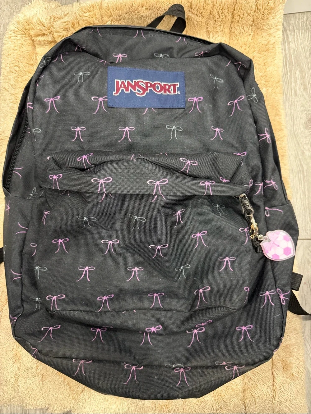 Jansport Black Backpack with Pink Bow Pattern and Heart Charm